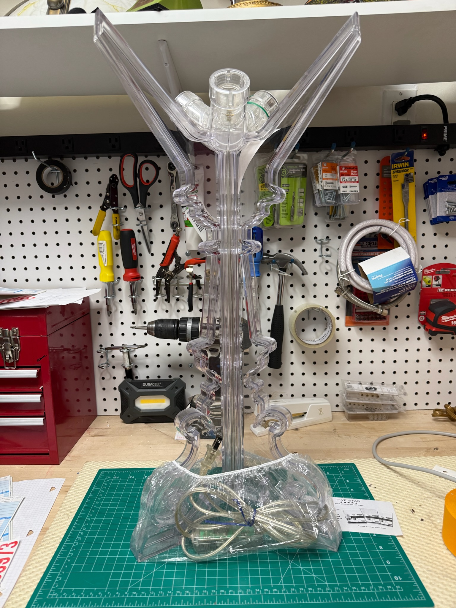 A Kartell Bourgie lamp sitting in our shop workstation that we repaired